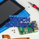 Raspberry Pi touchscreen repair kit with tools and circuit board for electronics projects.