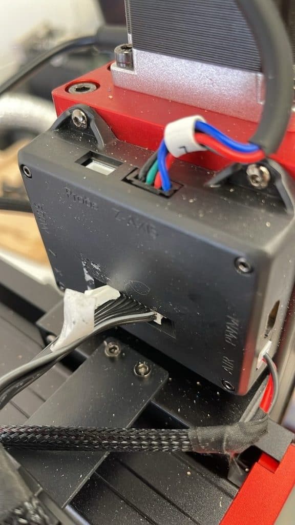 Small industrial servo motor with wiring connected for 3D printer or CNC machine, part of Maker Hacks DIY electronics.