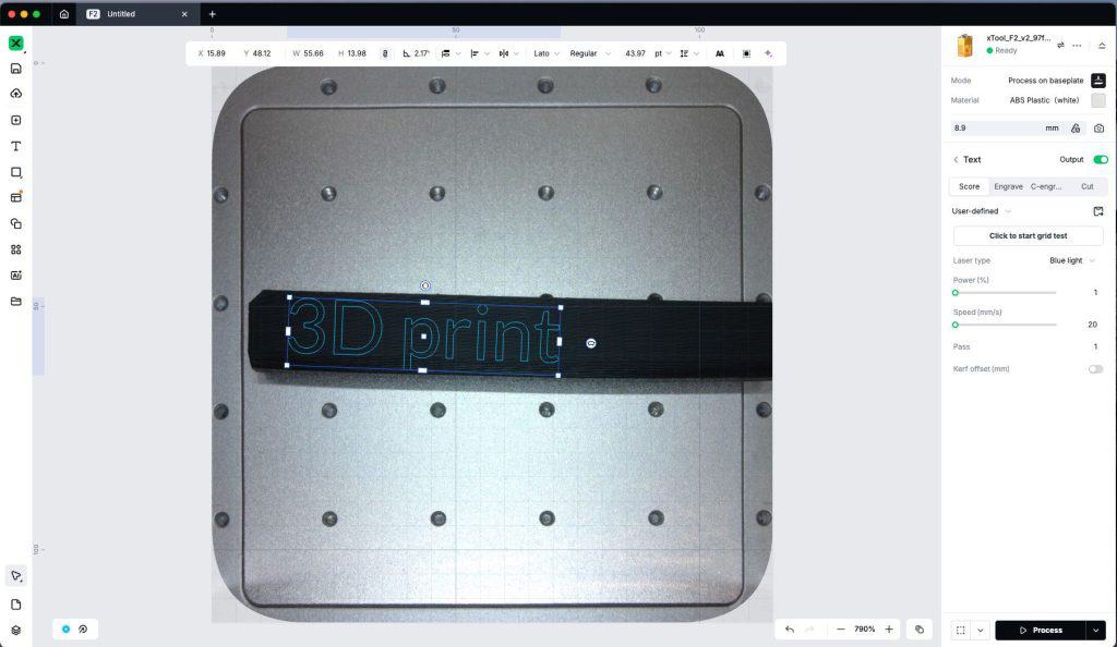 3D print engraving on a black strap with a metallic baseplate.