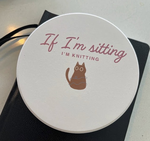 Coaster: "If I'm sitting, I'm knitting"