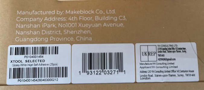 Close-up of manufacturing information and barcodes on the xTool sticker paper.