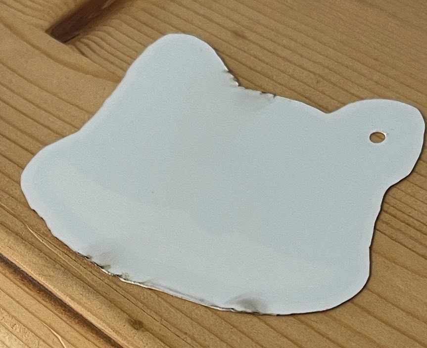 Shrinky cut on the laser showing flashback on reverse side