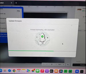 XTool M2 firmware update screen showing 68% downloaded progress.