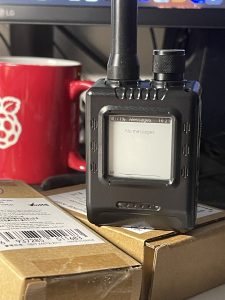 Elecrow ThinkNode M1 LoRa node with antenna, standing on its box