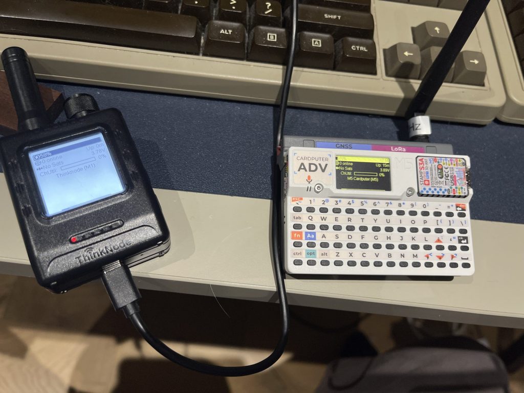 ThinkNode M1 and M5Stack Cardputer ADV running Meshtastic side by side