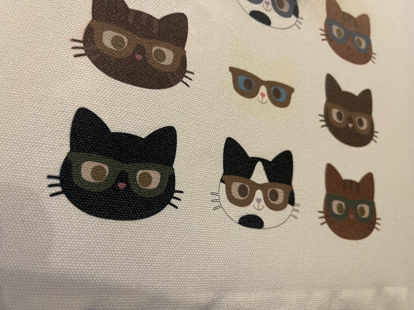 DTG printed cats in glasses pattern on a natural canvas tote