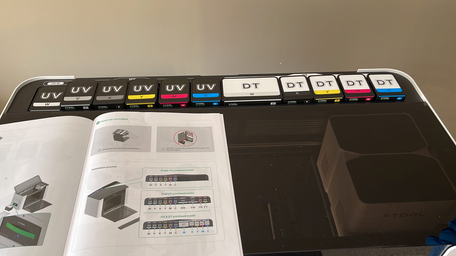 UV and DT ink modules lined up in the xTool O1 Omni